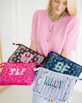 Madison holding four quilted bandana bags monogrammed CJ, BF, TLF and MACY